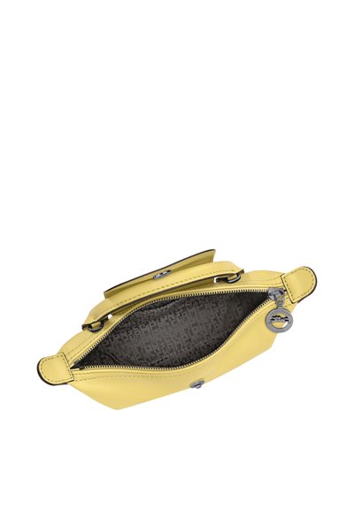 Yellow leather handbag with top zipper open, showing dark patterned fabric interior and silver zipper pull with circular detail.