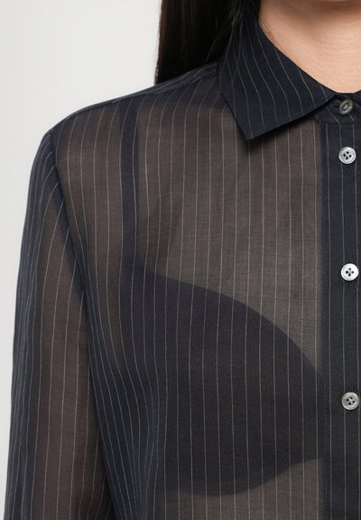 Navy blue, sheer button-up shirt with vertical stripes, featuring a collar and decorative buttons, showcasing a lightweight texture.