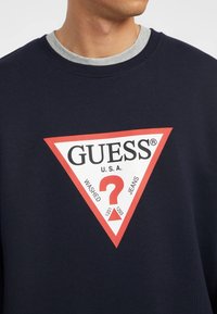 Guess Jeans ICONIC - Melegítőfelső - dunkelblau