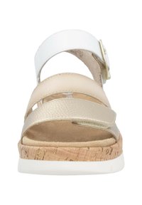 Open-toe sandal with three adjustable straps in white and beige, cork midsole, textured leather, and a slip-resistant white outsole.