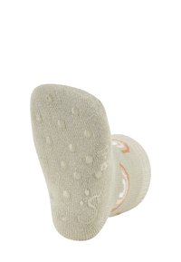 Beige Sock mit strukturiertem Fußbett, das erhöhte Punkte für besseren Halt bietet. Akzentuiert mit einem orangefarbenen Design aus glattem Strickstoff.