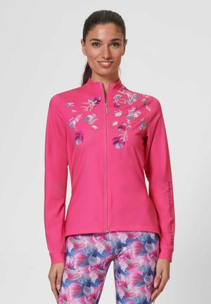 Heldroze sportjack met rits en bloemenprint op de voorkant, met lange mouwen en een gladde textuur. Versterkt met branding op de mouw.