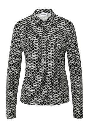 Camicia a maniche lunghe bianca e nera con un motivo a catena geometrica, chiusura con bottoni e colletto classico. Tessuto morbido.