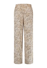 Pantalons cropped à motifs beige avec des taches noires abstraites, dotés d'une taille élastique et d'une texture de tissu léger et doux.