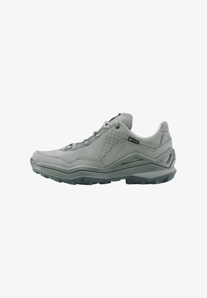 Gray low-cut hiking shoe with sturdy sole, lace-up closure, ventilation holes, and Gore-Tex label on side for waterproofing.