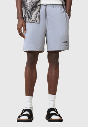 Light gray swim shorts with an elastic waistband and drawstring. Features side pockets and one embroidered logo on the front.