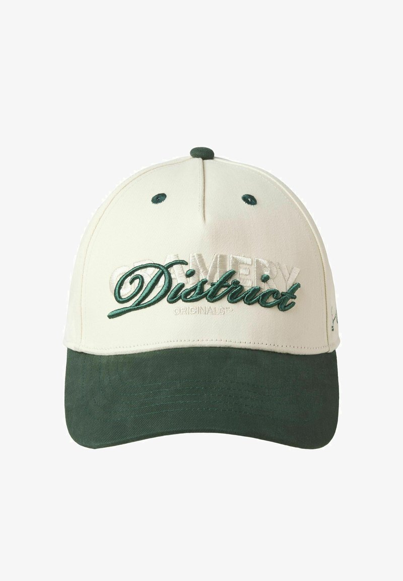 Cream and dark green cap with a structured design, featuring embroidered "Amery District" in green and "Originals" in subtle gray.