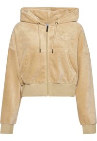 Hoodie zippé cropped en velours côtelé beige doux. Doté d'une capuche, de deux poches avant et de poignets élastiques avec un détail de logo subtil.