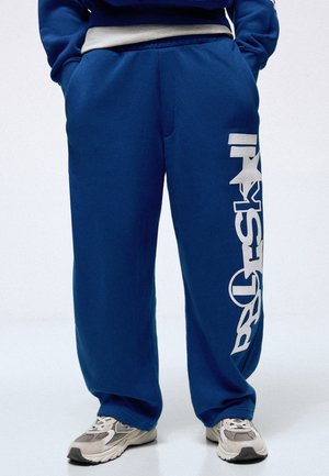 Bershka BALLOON FIT WITH SIDE PRINT - TROUSERS - Jogginghose - blue