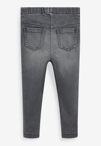 Leggings de mezclilla gris con una textura suave, cinturilla elástica y dos bolsillos traseros con acentos metálicos. No hay bolsillos delanteros visibles.