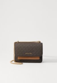 Brown patterned handbag with a gold chain strap and tan leather accent. Features a magnetic flap closure. Manufacturer: Michael Kors.