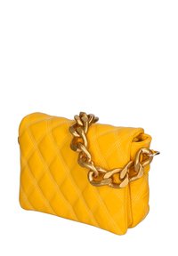 Yellow quilted leather handbag with a geometric pattern, featuring a large metal chain strap and a folded top, smooth texture.