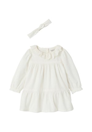 Weißes Baby-Kleid mit langen Ärmeln, Rüschenkragen und passendem weißem, geknotetem Stirnband.