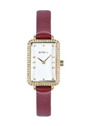 Orologio rettangolare dorato con quadrante bianco, cinturino in pelle bordeaux e dettagli in cristallo attorno alla lunetta. Presenta sei indici delle ore.