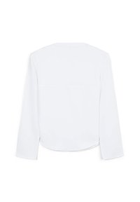 Camicia bianca a maniche lunghe con orlo arrotondato. Tessuto morbido con una leggera lucentezza. Design semplice, con dettaglio dello spallaccio posteriore.