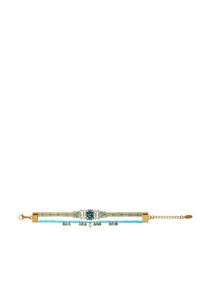 Delicate bracelet with turquoise beads, gold accents, a central blue gemstone, clear crystals, and a gold adjustable chain clasp.