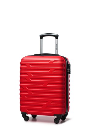 Red hard-shell suitcase with a textured zigzag pattern, an extendable silver handle, and four black wheels for mobility.