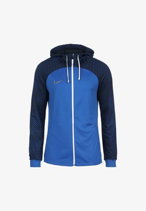 Sweat à capuche Nike bleu avec fermeture éclair complète, manches et capuche à motifs géométriques bleu foncé, fermeture éclair blanche et cordons blancs.