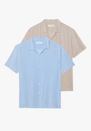 Two short-sleeve shirts are displayed; one in light blue and one in beige. Both feature a collared design and button front, with a smooth texture.