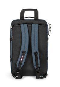 Back view of a rectangular black and blue backpack with padded adjustable straps and a top handle.