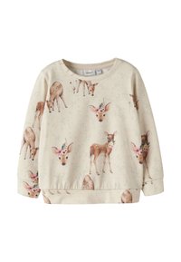 Beežist pusa ümara kaeluse ja korduva hirve- ning lillemustriga. Pehme kangas, lõdvestunud istuvus ja soonikkoes ääris.