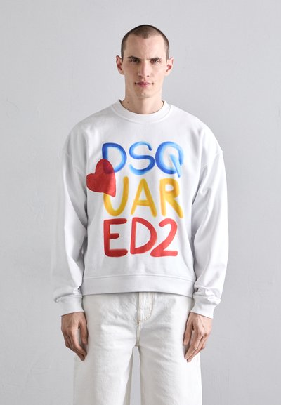 White sweatshirt featuring multicolored text design in blue, red, yellow, and orange. Crew neck, long sleeves, relaxed fit.