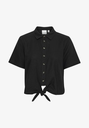 Schwarzes Kurzarmhemd mit knöpfbarem Front und Kragen. Verfügt über eine geknotete Krawattenapplikation am Saum und metallische Knopfakzente.