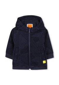 Hoodie zippé bleu marine avec des motifs géométriques, en tissu doux, avec des poignets côtelés et un petit patch logo jaune sur le côté gauche à l'avant.