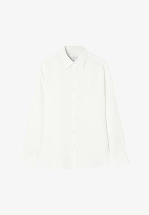 Valge pikkade varrukatega särk, mis on valmistatud siledast kangast, ning millel on nööpidega esikülg, klassikaline kaelus ja sirge alläär, mille külgedel on ümarad servad.