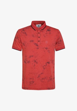 Rode poloshirt met een knoopsluiting bij de kraag, voorzien van een bamboepatroon in donkerblauw en contrasterende marineblauwe accenten op de mouwen en de kraag.