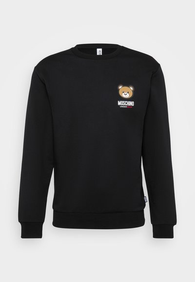 Black cotton sweatshirt with round neck, ribbed cuffs, and waist. Features a bear graphic and "MOSCHINO" printed in white and red.
