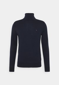 Marineblauer Rollkragenpullover aus weichem Stoff, mit langen Ärmeln, körpernaher Passform und einem kleinen Logo-Detail auf der Brust.