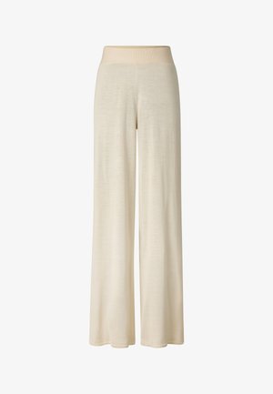 Beige broek met brede pijpen, elastische tailleband, zacht materiaal en een losse pasvorm.