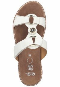 White leather slide sandal with crisscross straps, circular brown accent, and textured brown insole. Size 38 marked on the footbed.