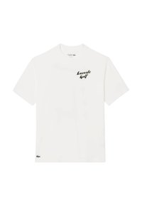 Camiseta blanca de algodón con mangas cortas, que presenta un logo negro de "Lacoste Golf" en el pecho y un emblema de cocodrilo verde en el dobladillo.