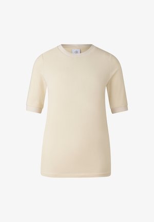 Lichtbeige T-shirt met korte, opgerolde mouwen. Zacht katoenen materiaal, ronde halslijn en minimalistisch ontwerp zonder patronen of accenten.