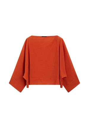 Blouse ample en lin orange rouille avec de larges manches trois-quarts et un col bateau.