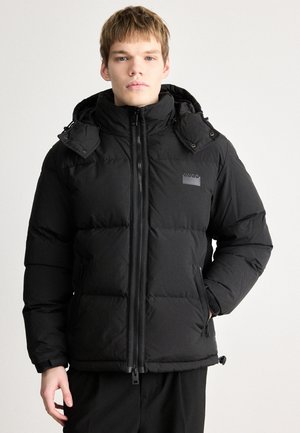 Black puffer jacket with a high collar, zippered front, dual side pockets, and adjustable hem. Material appears smooth with a soft texture.