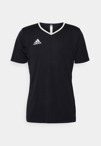 Svart Adidas t-shirt med V-hals och korta ärmar, med en vit accent längs kragen och en liten vit logotyp på vänster bröst.
