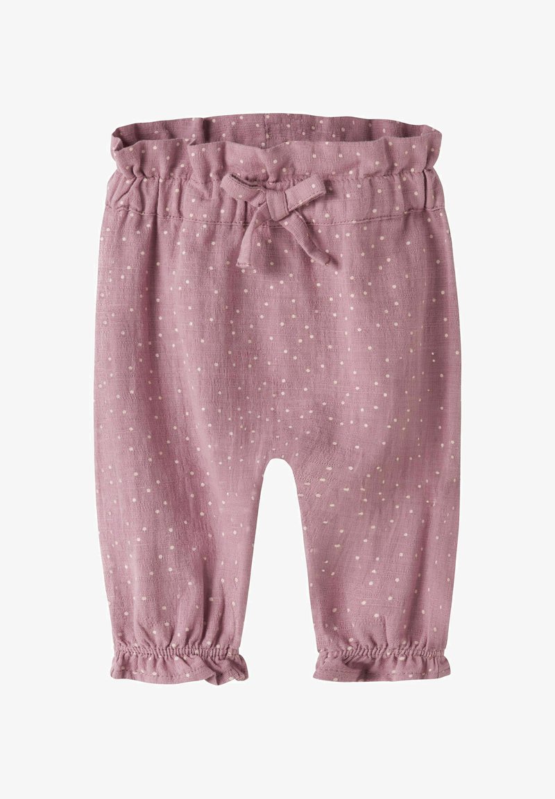 Pantalon bébé rose avec des pois blancs, taille élastique avec un nœud, et poignets froncés aux chevilles.