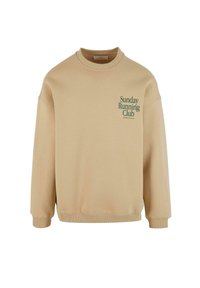 Sweatshirt bej din bumbac, cu guler rotund și umeri lăsați. Text verde "Sunday Running Club" în partea stângă sus.