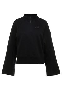 Sweat-shirt à col montant noir avec zip sur le devant, épaules tombantes et tissu texturé. Présente un logo subtil sur la poitrine.