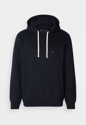 Marineblauer Hoodie aus weichem Baumwollmix, mit einer vorderen Kängurutasche, verstellbaren Kordeln und einem kleinen Logoakzent auf der Brust.