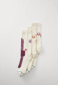 Calcetines blancos con ilustraciones de un sable de luz y varios símbolos sobre un suave tejido de punto, con áreas de tobillo y puntera reforzadas.