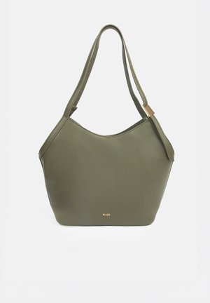 Olive green leather shoulder bag with adjustable straps, gold buckle detail, and small gold "RAID" logo centered near the bottom.