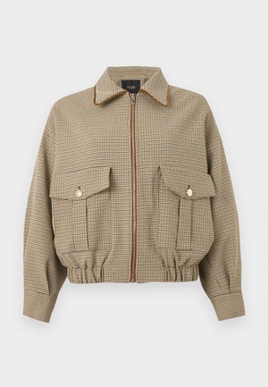 Veste zippée à carreaux marron et beige avec grandes poches à rabat sur le devant, ourlet élastiqué et col pointu.