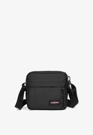 Czarna torba crossbody Eastpak wykonana z trwałego nylonu. Posiada zamykaną na zamek główną komorę, przednią kieszeń i regulowany pasek.