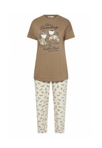 Brun kortärmad T-shirt med ett café-tema grafik; krämfärgade byxor med croissantmönster. Båda plaggen är tillverkade av mjukt tyg.