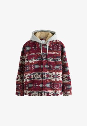 Sarkans un krēmīgs pārklājs ar pelēku kapuci, ar flīsa odere ap kaklu un pogu aizdari. Rakstos ietilpst ģeometriski dizaini un akcenti.