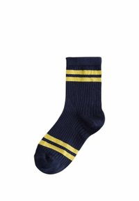 Chaussette côtelée bleu marine avec deux rayures jaunes près de la bordure et deux rayures jaunes près de la zone des orteils.